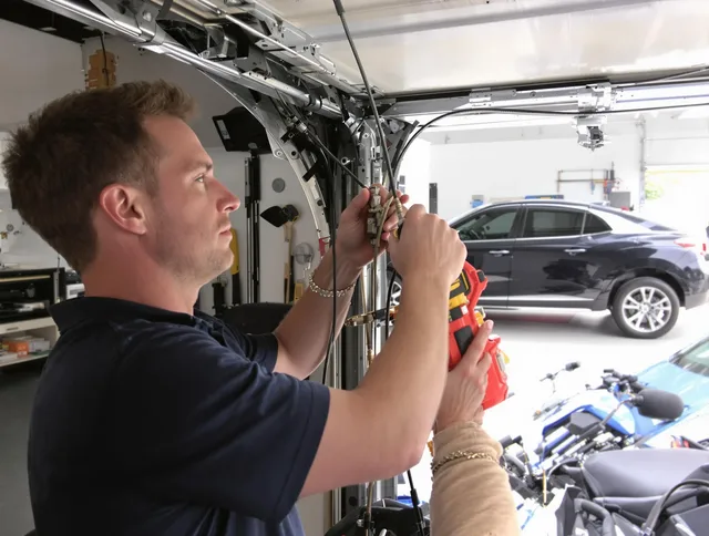 Boynton Beach Garage Door Repair safety certified technician performing cable replacement in Boynton Beach
